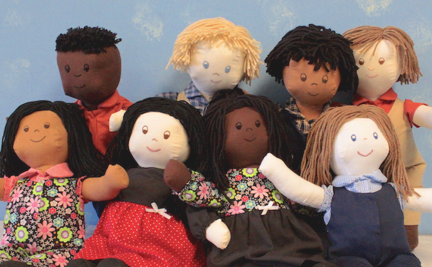 Several Comfort Kids on a couch